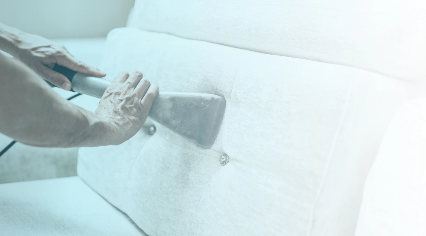 worker cleaning sofa Kountze TX